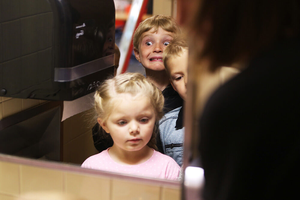 Christian Nelson makes a face at himself in the mirror